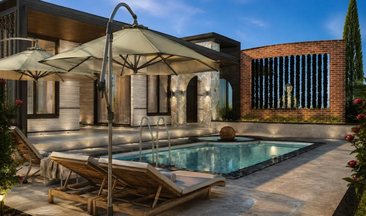 Swimming pool at dusk beside the brick screen wall by SMA Architect