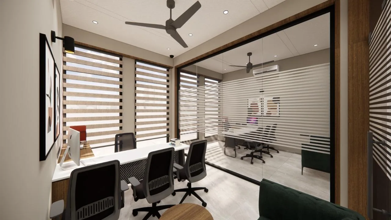 Workstation room with conference room beyond a glass partition by SMA Architect